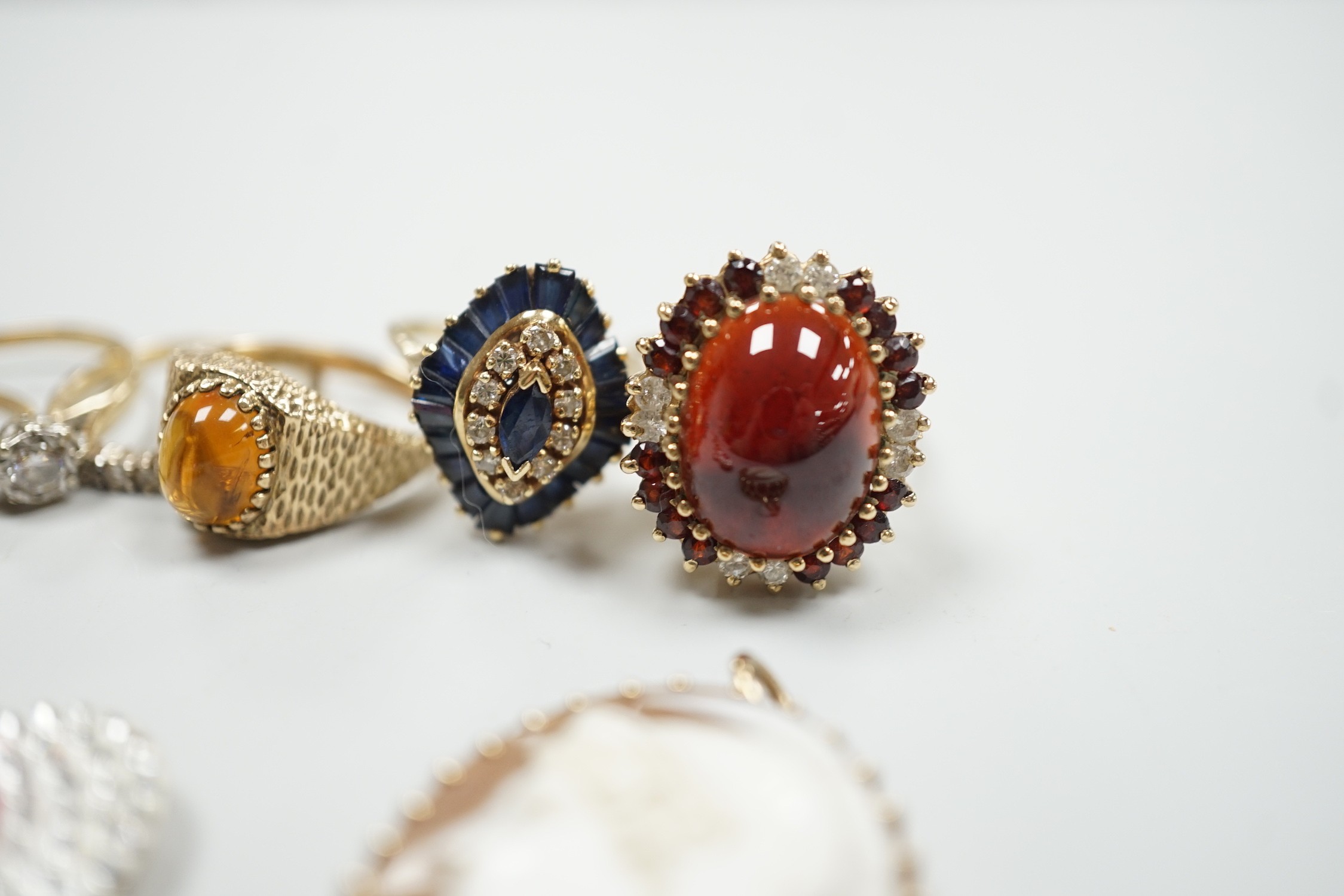 Eight assorted mainly modern 9ct gold and gem set dress rings, including amethyst and split pearl cluster, gross weight 30.7 grams, a 15ct, ruby and seed pearl set open work circular brooch, gross 2.6 grams, pair of 9ct,